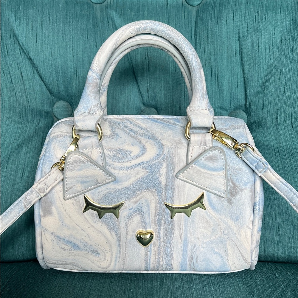 Blue Marble Betsy Johnson Kitty Handbag featuring nose, eyes & ears accents.